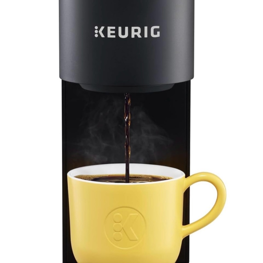 Keurig Black Coffee Maker with Yellow Mug